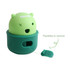 A green dog treat dispenser toy featuring a bear design with a removable top and a small opening for treats.