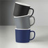 Three ceramic mugs in black, grey, and navy stacked with white interiors, featuring a logo on the side.