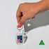 A hand holds a clear tear drop acrylic keychain featuring the Australian flag. The keychain has a silver ring and a logo.