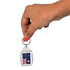 A hand holding a tear drop-shaped acrylic keychain featuring the Australian flag design.