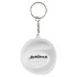 A keychain featuring a round white design with a logo and branding.