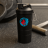 A drink bottle featuring a black shaker cup with a logo, equipped with a carabiner.