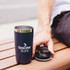 A drink bottle in navy blue with a stainless steel rim and a removable lid, featuring a logo on its side.