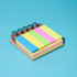 A Mini Bamboo Sticky Note Set featuring pink, yellow, and green sticky notes in a spiral-bound design. A Mini Bamboo Sticky Note Set featuring pink, yellow, and green sticky notes in a spiral-bound design.