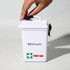 A white waterproof first aid kit with a black handle and a green cross symbol. It features a logo on the front.