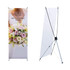 A medium X-frame banner featuring a floral design with pink and white flowers, supported by a black frame.