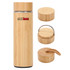 A drink bottle made of bamboo, featuring a sleek design and two detachable lids, one with a metal handle.