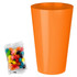 An orange party cup beside a clear packet of assorted jelly beans in various vibrant colours.