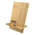 A bamboo phone holder with a textured finish, featuring a small hole and a logo on the front.