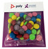 A clear bag filled with brightly coloured choc beans, including green, pink, yellow, and purple, on a branded backing.