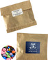 Kraft paper bag containing colourful choc beans with a logo on the front. Features assorted pastel-coloured sweets.