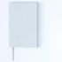 A grey notebook featuring a dotted pattern and a matching elastic closure, with a ribbon bookmark.