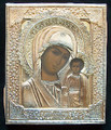 The riza is marked with a silver mark  "84"  a maker's  mark (P.T.) and a right facing kokoshnik with triangle. The lower edge of the riza also has a full maker's mark for the V.S. Krestyaninov Factory, Moscow. The painting has been touched up in two places on the Madonna's face and there is some minor chipping of the paint where the riza has rubbed against the panel. The wood panel is covered at the back with faded red velvet.