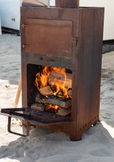 Weltevree Outdoor Stove Oven Door open on the outdoor stove with a flames Weltevree Outdoor Stove Oven Door open on the outdoor stove with a flames