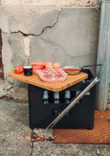 Food being prepared on the Höfats BEER BOX Board – Bamboo Top