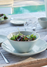 A bowl of salad served on top of the Costa Nova Dinner Plate – Nova Collection, 27 cm in Turquoise A bowl of salad served on top of the Costa Nova Dinner Plate – Nova Collection, 27 cm in Turquoise