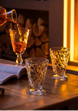 La Rochere Lyonnais Wine Glass Set of 6 (23cl) on a table with wine being poured into it