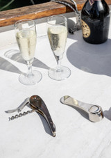L’Atelier du Vin Corkscrew Set – Oeno Collection 4 on a table with glasses