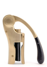 L’Atelier du Vin Oeno Motion Gold Nomad Lever Corkscrew on a white background L’Atelier du Vin Oeno Motion Gold Nomad Lever Corkscrew on a white background