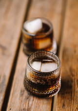 Two La Rochere Blossom Whiskey Glasses with ice and whiskey