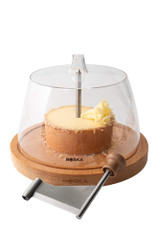 Boska Cheese Curler Amigo with Dome 850511 – beechwood base, stainless blade, and clear dome cover, shown on a white background. Boska Cheese Curler Amigo with Dome 850511 – beechwood base, stainless blade, and clear dome cover, shown on a white background.