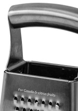 Boska Table Grater Monaco+ – stainless steel box grater with four grating surfaces and ergonomic handle, close up of the handle. Boska Table Grater Monaco+ – stainless steel box grater with four grating surfaces and ergonomic handle, close up of the handle.