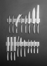 Boska Cheese Knife Set Monaco+ – set of three stainless steel cheese knives with waffle-pattern blades, shown on knife rack. Boska Cheese Knife Set Monaco+ – set of three stainless steel cheese knives with waffle-pattern blades, shown on knife rack.