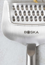 Boska Cheese Grater Copenhagen – stainless steel handheld grater with hollow handle, shown close up of branding. Boska Cheese Grater Copenhagen – stainless steel handheld grater with hollow handle, shown close up of branding.