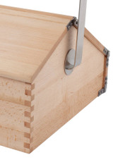 Redecker shoe cleaning box — oiled beechwood, closed view with stainless-steel handle, close up view. Redecker shoe cleaning box — oiled beechwood, closed view with stainless-steel handle, close up view.
