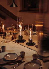 Two Höfats SPIN 1200 Tabletop Fireplaces on a table indoors Two Höfats SPIN 1200 Tabletop Fireplaces on a table indoors