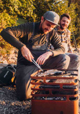 Outdoor cooking on the Höfats CUBE Fire Basket using the grill accessory