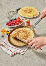 Pancakes served in the De Buyer Carbone Plus Crepe Pan at the table