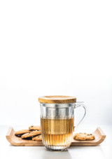 La Rochere Ouessant Glass Tea Mug with Infuser & Bamboo Lid , with a tea serving with cookies