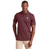 Model wearing an oxblood colored Travismathew Sunnyvale polo with embroidered Watkins Wellness logo.