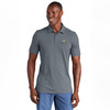 Model wearing aTravismathew Sunnyvale polo in  blue heather nights  with embroidered Watkins Wellness logo.