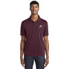 Model wearing Sport-Tek® PosiCharge® RacerMesh® Polo with Watkins Wellness embroidered logo on a white background.