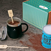 Cocoa Cozy gift set with watkins wellness logo on table.