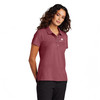 Model is wearing Rosewood Mercer+Mettle® Women’s Stretch Pique Polo Shirt.