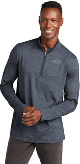 Model wearing VINTAGE INDIGO HEATHER Color TravisMathew Crestview 1/4 Zip with white background