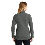 Model is wearing The North Face Ladies Sweater Fleece Jacket in black color back view
