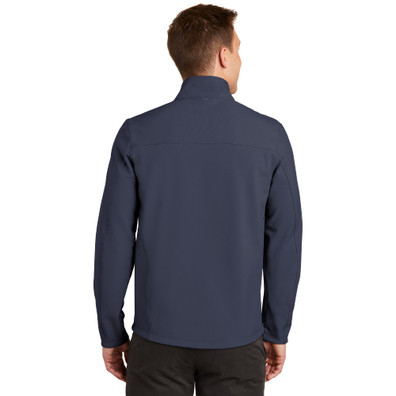 Model is wearing Collective Soft Shell Jacket in navy color back view
