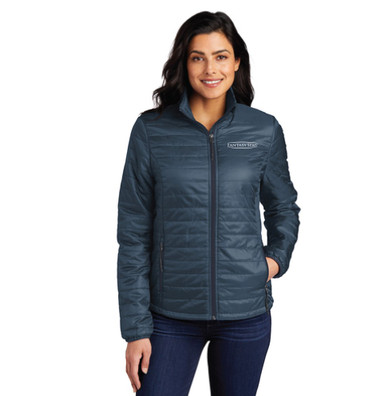 Women wearing River Blue Color Ladies Packable Puffy Jacket with white background