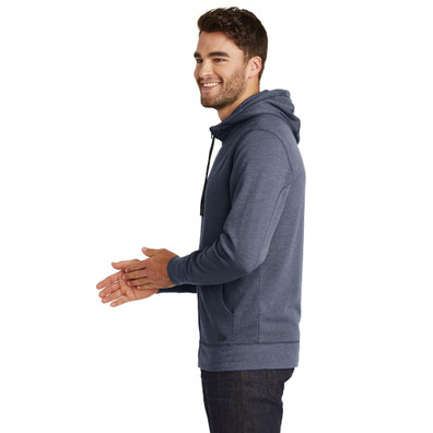 Model is wearing New Era Tri-Blend Fleece Heathered Hoodie in navy color side view