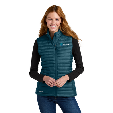 Women wearing Blue Eddie Bauer® Women’s Packable Quilted Vest with white background