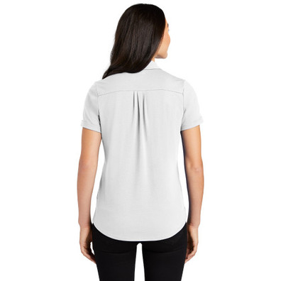 OGIO Ladies Limit Polo  in white on model. 