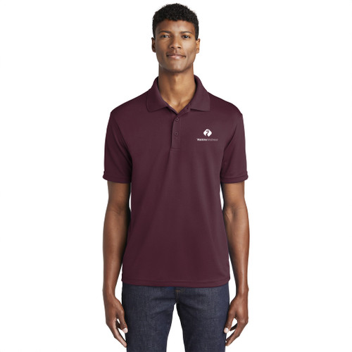 Model wearing Sport-Tek® PosiCharge® RacerMesh® Polo with Watkins Wellness embroidered logo on a white background.