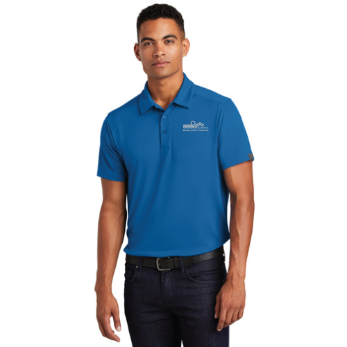 Man wearing Blue-Grey Logo OGIO Mens Framework Polo