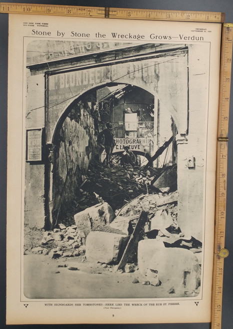 With signboards her tombstone, here lies the wreck of the Rue Saint Pierre. Stone by stone the wreckage grows in Verdun. Original Antique WWI Print, photo 1916.