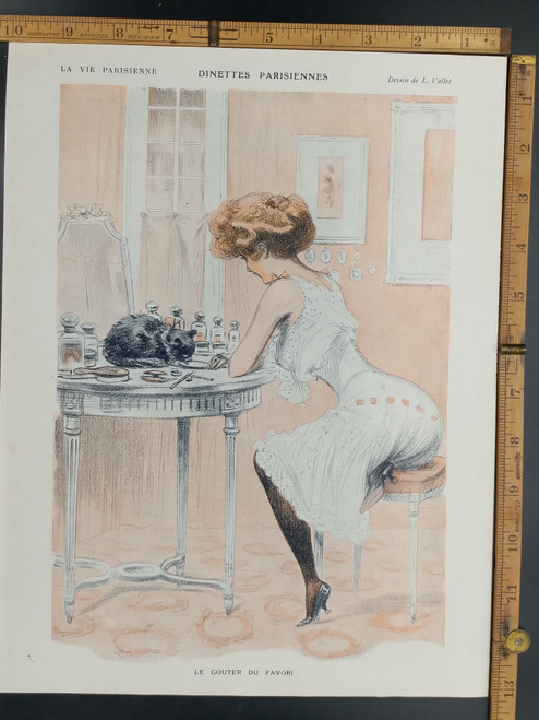 Parisian dinettes by L. Valet. A French lady feeding a black cat on a table. Original Antique French print from 1909.