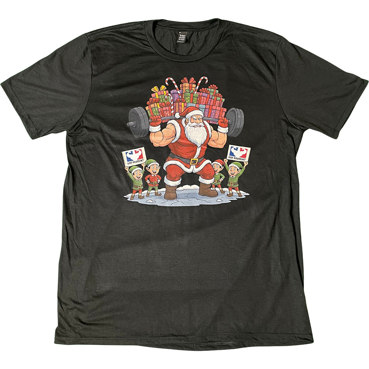 Black GotProtein Christmas T-shirt featuring muscular Santa lifting a barbell loaded with gifts while elves cheer beside him